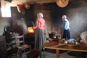 Colonial hearth cooking at Plimoth Plantation. Bonnet not included in admission.